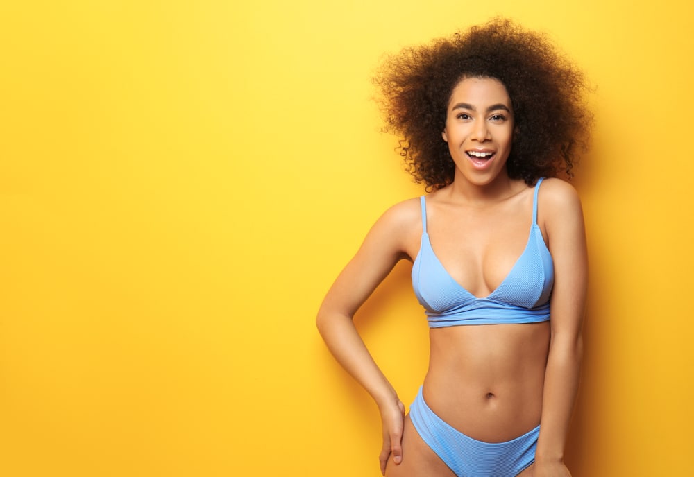Beautiful,African-american,Woman,In,Bikini,On,Color,Background